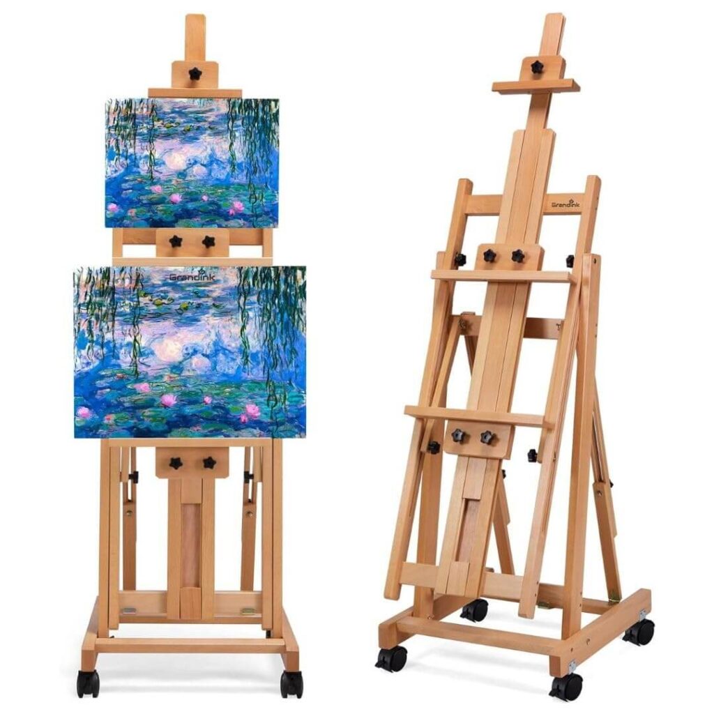 Grandink Professional Studio featuring a large H-Frame easel, classical busts for reference, and landscape paintings on a bright gallery wall.